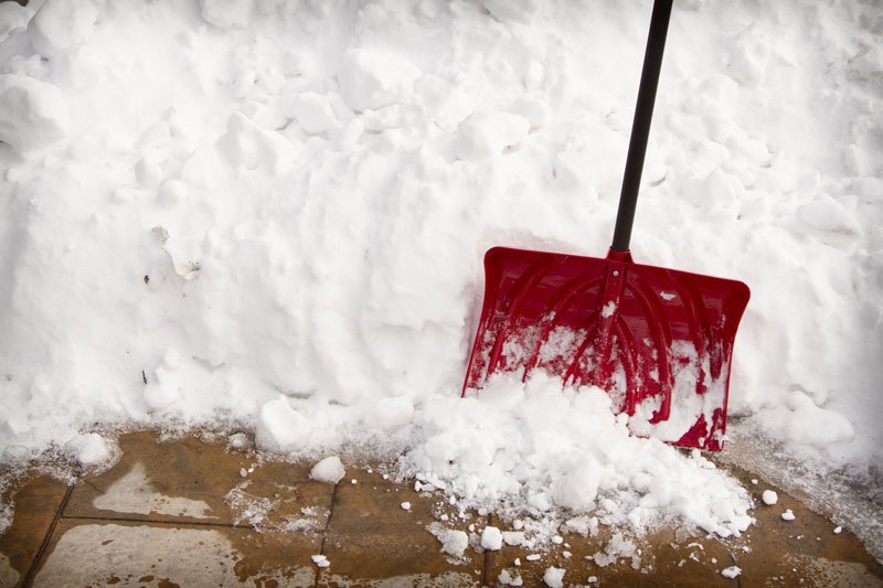 snow shovel next to snow