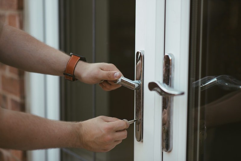 person locking a door