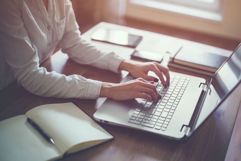 a person working from home on a laptop