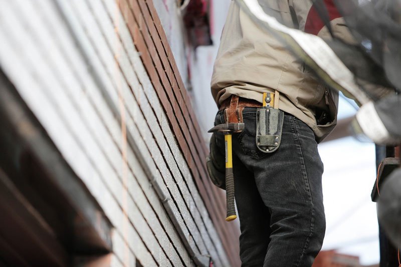 a contractor working on a house